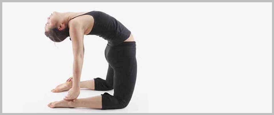 Instructor Helping Pregnant Lady Doing Camel Pose